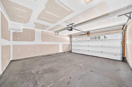 57 Aspen Hills Common Sw, Calgary, AB - Indoor Photo Showing Garage