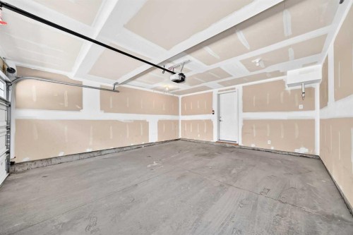 57 Aspen Hills Common Sw, Calgary, AB - Indoor Photo Showing Garage