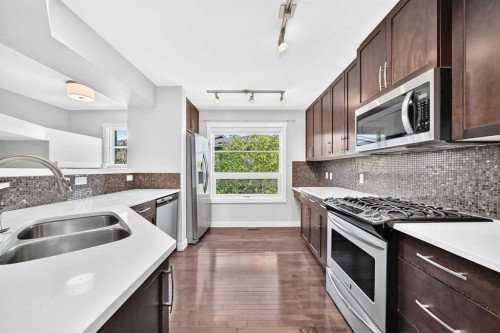 57 Aspen Hills Common Sw, Calgary, AB - Indoor Photo Showing Kitchen With Stainless Steel Kitchen With Double Sink With Upgraded Kitchen