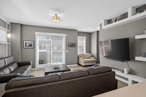 18-111 Rainbow Falls Gate, Chestermere, AB - Indoor Photo Showing Living Room