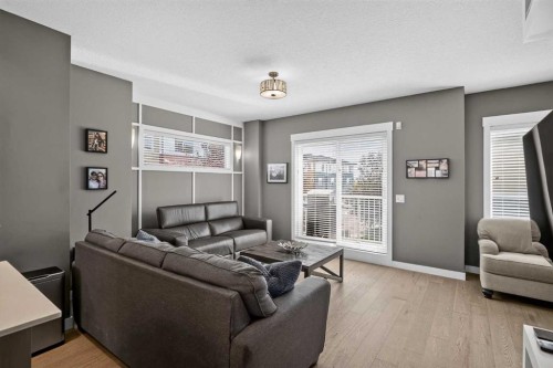 18-111 Rainbow Falls Gate, Chestermere, AB - Indoor Photo Showing Living Room