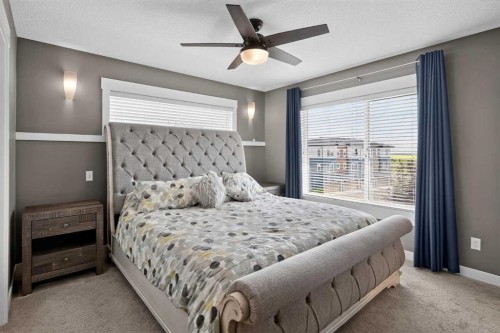 18-111 Rainbow Falls Gate, Chestermere, AB - Indoor Photo Showing Bedroom