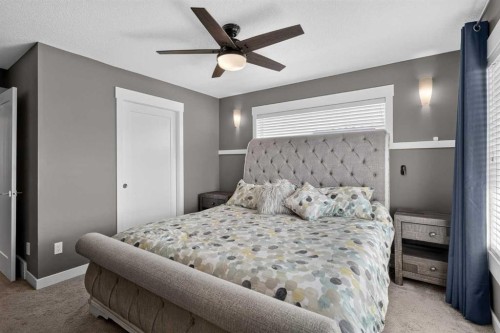 18-111 Rainbow Falls Gate, Chestermere, AB - Indoor Photo Showing Bedroom