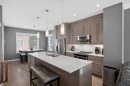 18-111 Rainbow Falls Gate, Chestermere, AB  - Indoor Photo Showing Kitchen With Double Sink With Upgraded Kitchen 