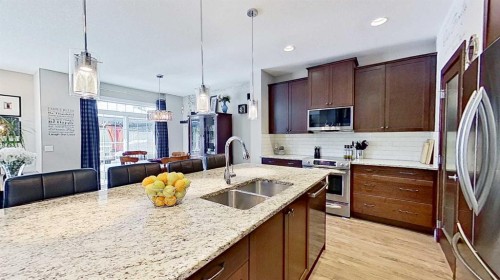 31 Ravenslea Crescent Se, Airdrie, AB - Indoor Photo Showing Kitchen With Double Sink With Upgraded Kitchen