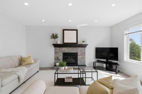 271 Sienna Park View Sw, Calgary, AB - Indoor Photo Showing Living Room With Fireplace