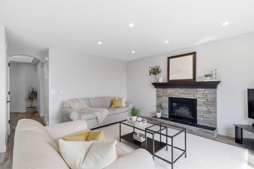 271 Sienna Park View Sw, Calgary, AB - Indoor Photo Showing Living Room With Fireplace