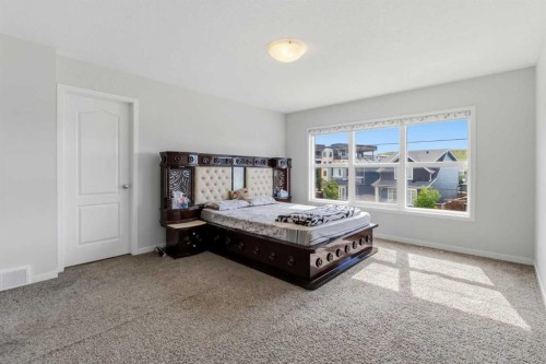 62 Wolf Hollow Way Se, Calgary, AB - Indoor Photo Showing Bedroom
