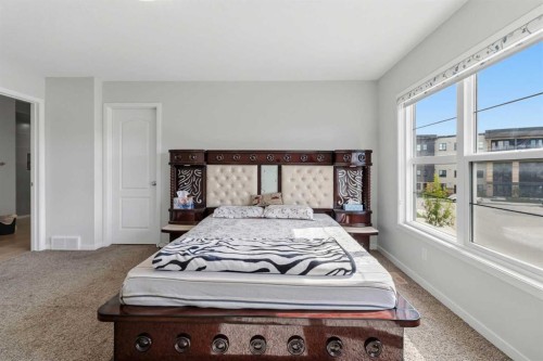 62 Wolf Hollow Way Se, Calgary, AB - Indoor Photo Showing Bedroom