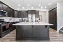 62 Wolf Hollow Way Se, Calgary, AB  - Indoor Photo Showing Kitchen With Stainless Steel Kitchen With Upgraded Kitchen 