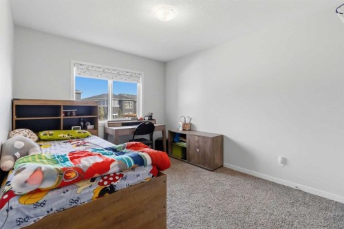 62 Wolf Hollow Way Se, Calgary, AB - Indoor Photo Showing Bedroom