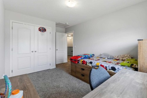62 Wolf Hollow Way Se, Calgary, AB - Indoor Photo Showing Bedroom