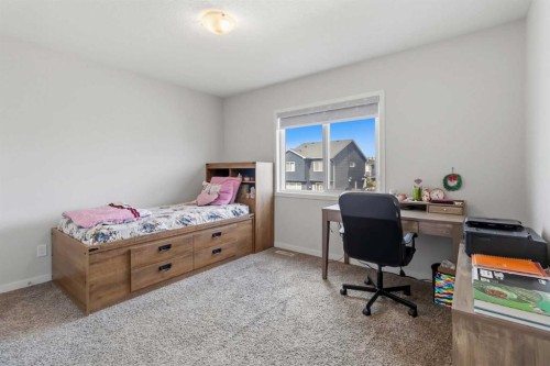62 Wolf Hollow Way Se, Calgary, AB - Indoor Photo Showing Bedroom