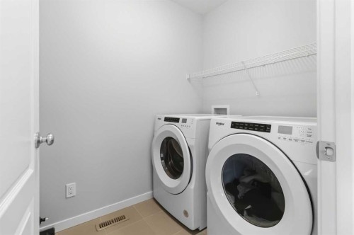 62 Wolf Hollow Way Se, Calgary, AB - Indoor Photo Showing Laundry Room