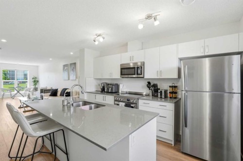 412 Cranbrook Square Se, Calgary, AB - Indoor Photo Showing Kitchen With Stainless Steel Kitchen With Double Sink With Upgraded Kitchen