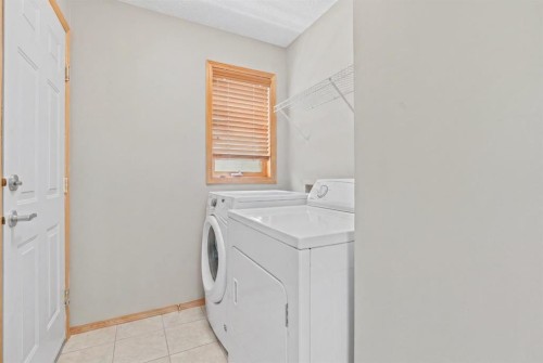 47 Coral Springs Close, Calgary, AB - Indoor Photo Showing Laundry Room