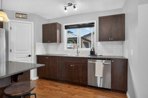 269 Silverado Way Sw, Calgary, AB - Indoor Photo Showing Kitchen With Double Sink
