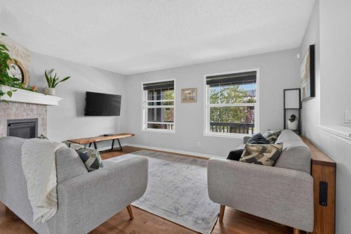269 Silverado Way Sw, Calgary, AB - Indoor Photo Showing Living Room With Fireplace