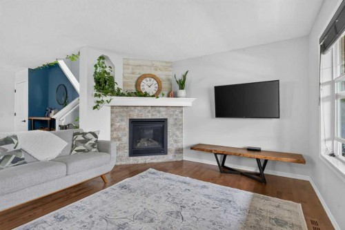 269 Silverado Way Sw, Calgary, AB - Indoor Photo Showing Living Room With Fireplace