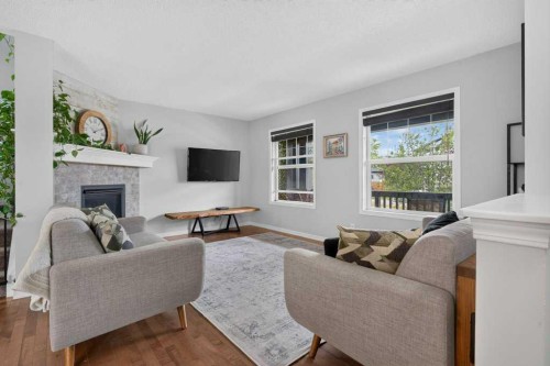 269 Silverado Way Sw, Calgary, AB - Indoor Photo Showing Living Room With Fireplace