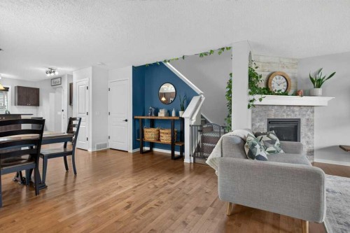 269 Silverado Way Sw, Calgary, AB - Indoor Photo Showing Living Room With Fireplace