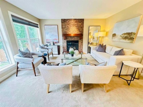 29 Everhollow Rise Sw, Calgary, AB - Indoor Photo Showing Living Room With Fireplace