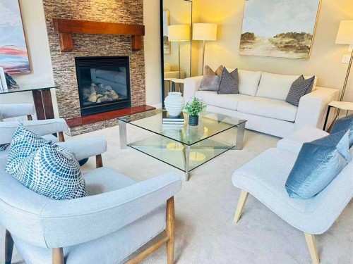 29 Everhollow Rise Sw, Calgary, AB - Indoor Photo Showing Living Room With Fireplace