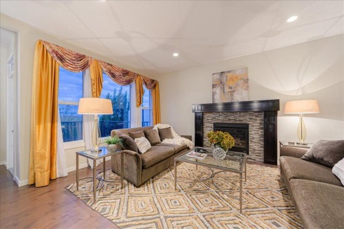 138 Copperpond Street Se, Calgary, AB - Indoor Photo Showing Living Room With Fireplace