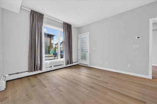 101-200 Shawnee Square Sw, Calgary, AB - Indoor Photo Showing Other Room