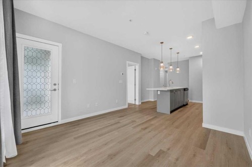 101-200 Shawnee Square Sw, Calgary, AB - Indoor Photo Showing Other Room