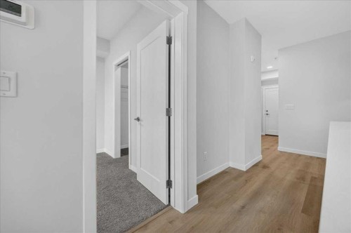 101-200 Shawnee Square Sw, Calgary, AB - Indoor Photo Showing Other Room