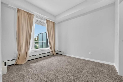 101-200 Shawnee Square Sw, Calgary, AB - Indoor Photo Showing Other Room