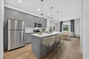 101-200 Shawnee Square Sw, Calgary, AB  - Indoor Photo Showing Kitchen With Stainless Steel Kitchen With Upgraded Kitchen 