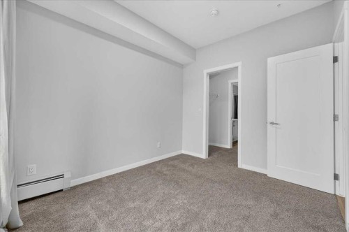 101-200 Shawnee Square Sw, Calgary, AB - Indoor Photo Showing Other Room