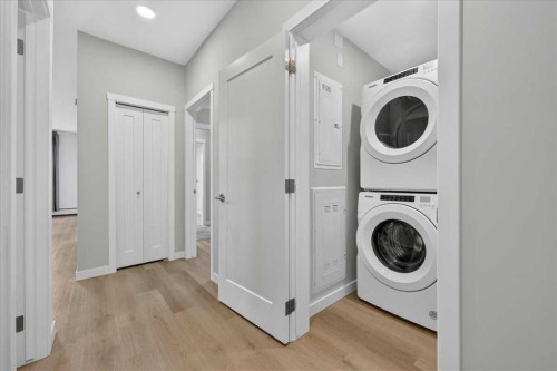 101-200 Shawnee Square Sw, Calgary, AB - Indoor Photo Showing Laundry Room
