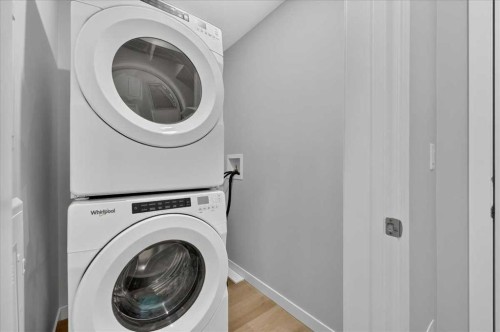 101-200 Shawnee Square Sw, Calgary, AB - Indoor Photo Showing Laundry Room