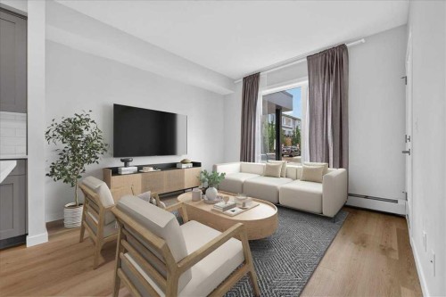 101-200 Shawnee Square Sw, Calgary, AB - Indoor Photo Showing Living Room