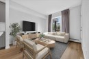 101-200 Shawnee Square Sw, Calgary, AB  - Indoor Photo Showing Living Room 