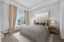 101-200 Shawnee Square Sw, Calgary, AB  - Indoor Photo Showing Bedroom 