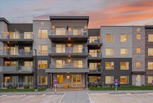 101-200 Shawnee Square Sw, Calgary, AB - Outdoor With Balcony With Facade