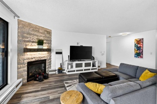 10-635 Marsh Road Ne, Calgary, AB - Indoor Photo Showing Living Room With Fireplace