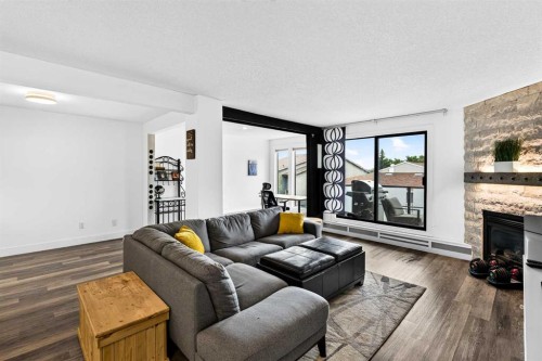 10-635 Marsh Road Ne, Calgary, AB - Indoor Photo Showing Living Room With Fireplace