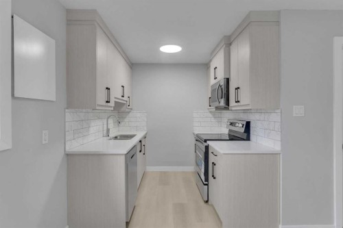 14-8112 36 Avenue Nw, Calgary, AB - Indoor Photo Showing Kitchen With Upgraded Kitchen