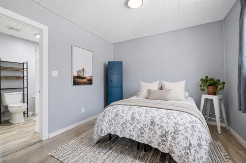302 Frontenac Avenue Nw, Diamond Valley, AB - Indoor Photo Showing Bedroom