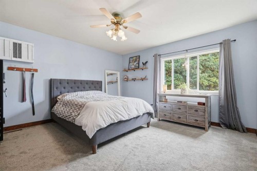 302 Frontenac Avenue Nw, Diamond Valley, AB - Indoor Photo Showing Bedroom
