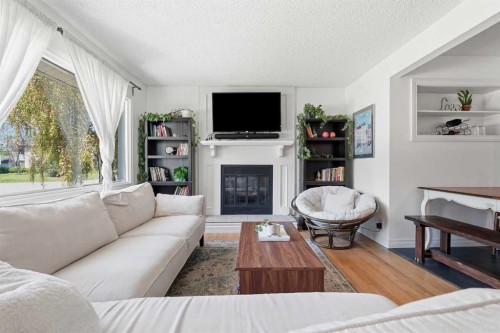 96 Waterloo Drive Sw, Calgary, AB - Indoor Photo Showing Living Room With Fireplace