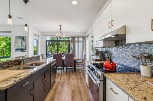 135 Tuscany Ravine Road Nw, Calgary, AB - Indoor Photo Showing Kitchen With Double Sink With Upgraded Kitchen