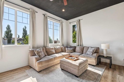 135 Tuscany Ravine Road Nw, Calgary, AB - Indoor Photo Showing Living Room