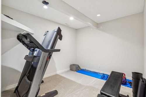 135 Tuscany Ravine Road Nw, Calgary, AB - Indoor Photo Showing Gym Room