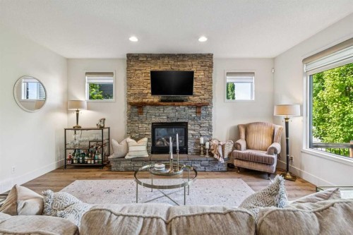 135 Tuscany Ravine Road Nw, Calgary, AB - Indoor Photo Showing Living Room With Fireplace